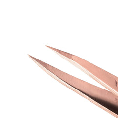 Tweezerman rose gold travel case—compact storage for on-the-go grooming.