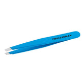 Tweezerman Slant Tweezer Blue Jewel tip close-up highlights precise hair grabbing for brows.