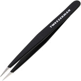 Tweezerman stainless steel point tweezer tip close-up showing precise alignment