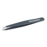 Tweezerman stainless steel slant tweezer blue stone closeup shows precise hair removal tips