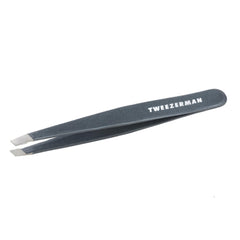 Tweezerman stainless steel slant tweezer blue stone closeup shows precise hair removal tips