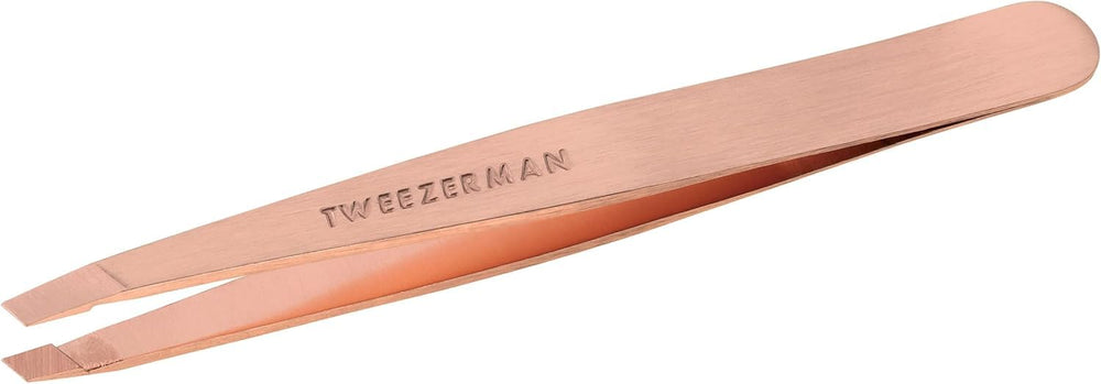 Tweezerman rose-gold slant tweezer close-up showing precision for brow shaping.