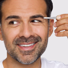 Tweezerman tweezer tip close-up emphasizes 25-degree angled grip for user control.