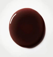 Typology lip oil application showing glossy, non-sticky finish.