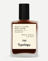Typology tinted lip oil bottle with black cherry color provides a nourishing glossy lip look.