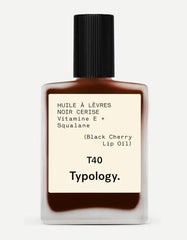 Typology tinted lip oil bottle with black cherry color provides a nourishing glossy lip look.
