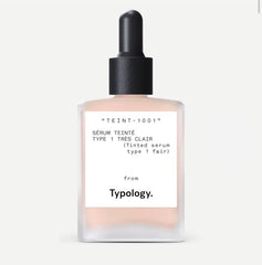 Typology tinted serum bottle with pump offers light coverage for a natural finish.