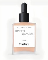 Typology Tinted Serum Type 2 Light bottle close-up highlights vitamin C and hydration.