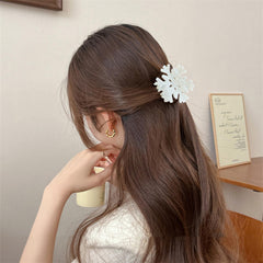 UCCASA Christmas Snowflake Hair Clip on curled hair adds festive charm and secure styling.