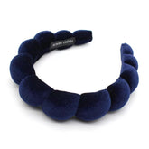 Uchyius navy blue padded headband closeup shows plush velvet and comfortable fit
