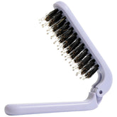 Uffy MiniPop folding brush open for on-the-go detangling.