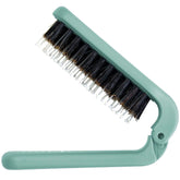 Uffy MiniPop travel brush folded for ultra-compact on-the-go styling