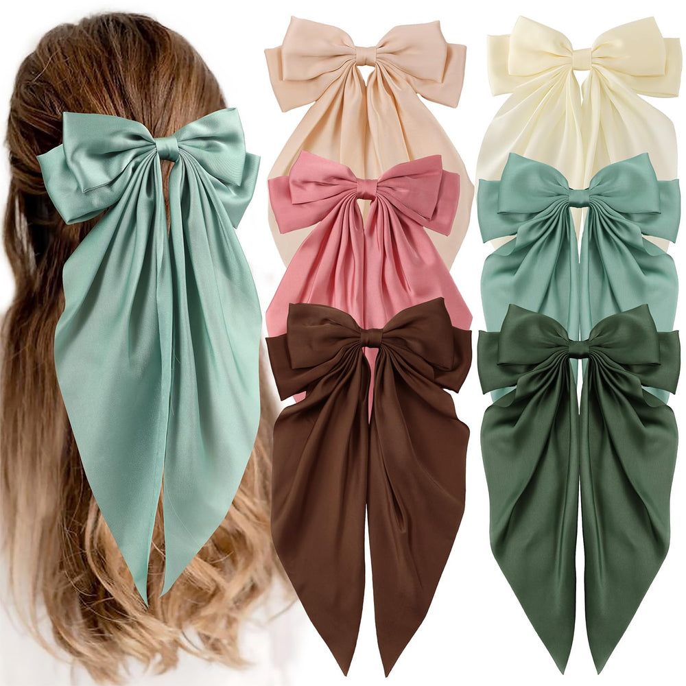 Unbednigt green bow clip front view, adds polished everyday elegance.