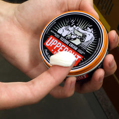 UPPERCUT DELUXE Texture Cream packaging emphasizes compact travel size.