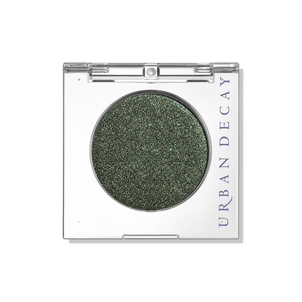 Urban Decay 24/7 Eyeshadow Psych warm-green metallic swatch highlights vibrant color with longwear potential.