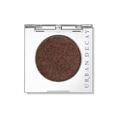 Urban Decay 24/7 Eyeshadow Ember swatch highlights rich copper pigment for a bold look.
