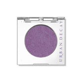 Urban Decay 24/7 Eyeshadow Single Freebird compact shows high-pigment lilac shimmer for smooth blending.