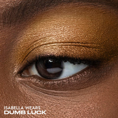Urban Decay Dumb Luck copper metallic swatch delivers radiant shimmer.