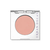 Urban Decay 24/7 Introvert peach matte compact close-up showing crease-free wear.