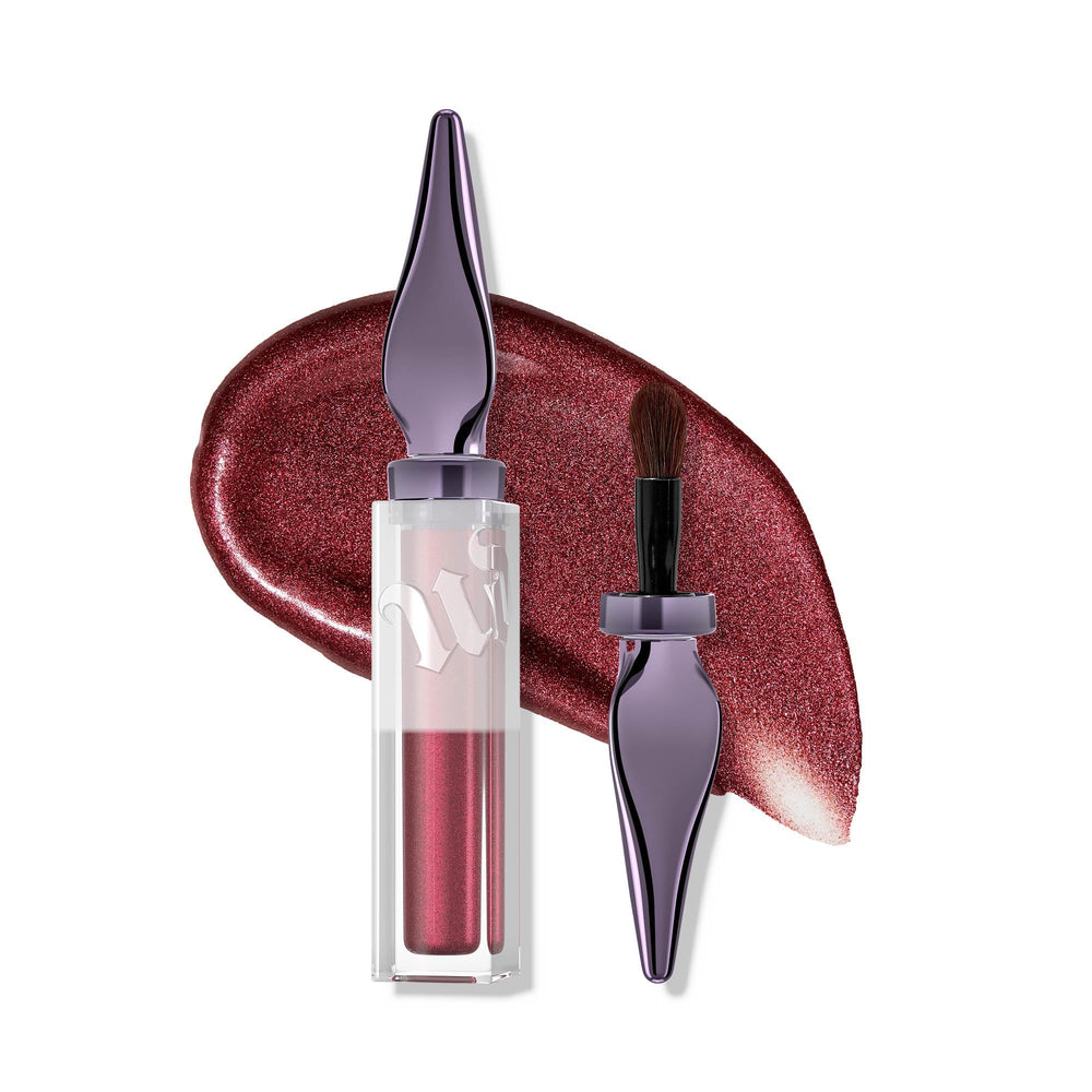Urban Decay 24/7 Glaze-On Traffic Jam bottle showing burgundy shimmer for eye-catching glow.