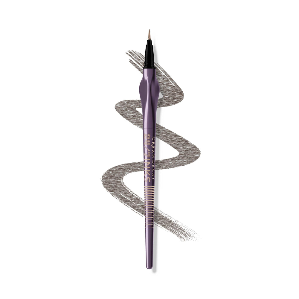Urban Decay 24/7 Inks Oil Slick bottle swirl highlights gunmetal shimmer for a bold eye look.