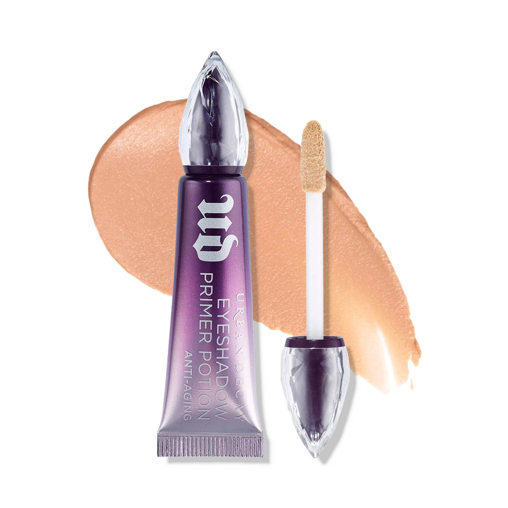 Urban Decay Anti-Aging Eyeshadow Primer Potion tube with nude base for even eyelids.