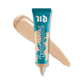 Urban Decay Hydromaniac bottle close-up shows dewy finish and hydration for dry skin.