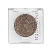 Urban Decay Moondust glitter close-up showing micro-glitter for luminous lids.