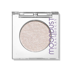 Urban Decay Moondust Space Cowboy swatch showing champagne gold sparkle for luminous eyes.