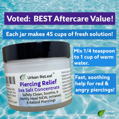 Urban ReLeaf Piercing Relief bottle showcases Dead Sea salt for soothing care.
