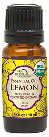 US Organic Lemon Oil bottle-pour highlights bright aroma and cleaning potential.