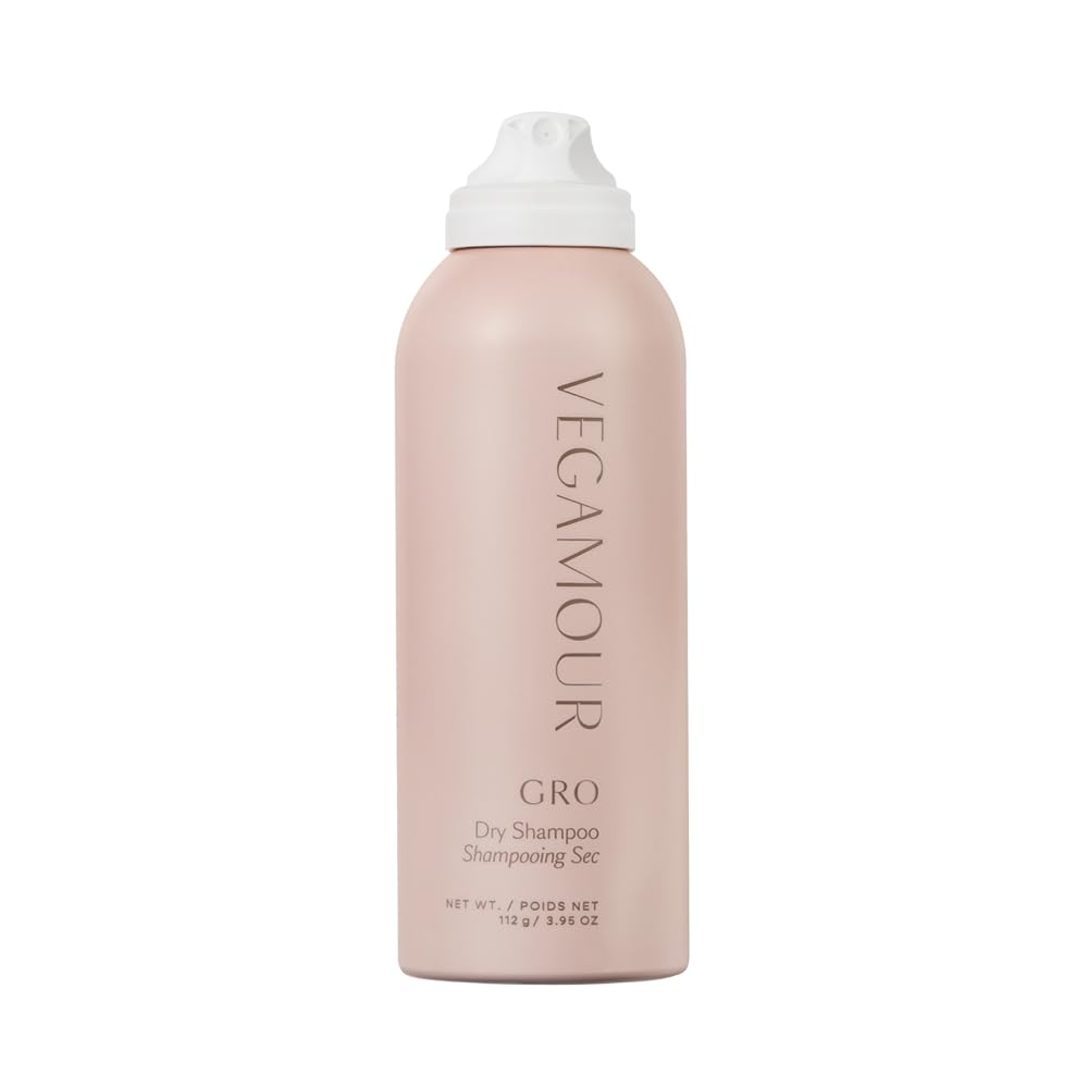 VEGAMOUR GRO Dry Shampoo bottle pouring for quick refresh and lift.
