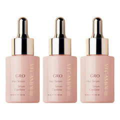 VEGAMOUR GRO Hair Serum bottle closeup showing a non-greasy daily-use formula.