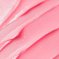 VEGAN J. lip balm application close-up revealing creamy, non-sticky glide.