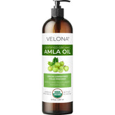 Velona Amla Oil bottle closeup showing pure organic hair nourishment.