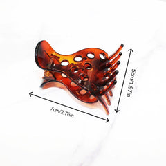 Venrodi root-clip closeup showing inner teeth grip for thick curly hair