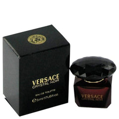 Versace Crystal Noir mini bottle closeup, portable luxury for on-the-go fragrance moments.