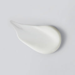 Versed Press Restart Retinol Body Lotion texture close-up shows a silky, non-greasy finish.