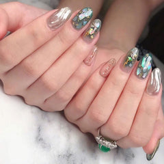 Vezocim 3D seashell slices enhance textured nail art with depth.