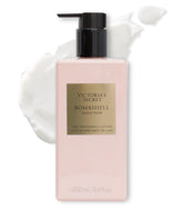 Victoria's Secret Bombshell Seduction lotion bottle on a dresser for everyday fragrance.