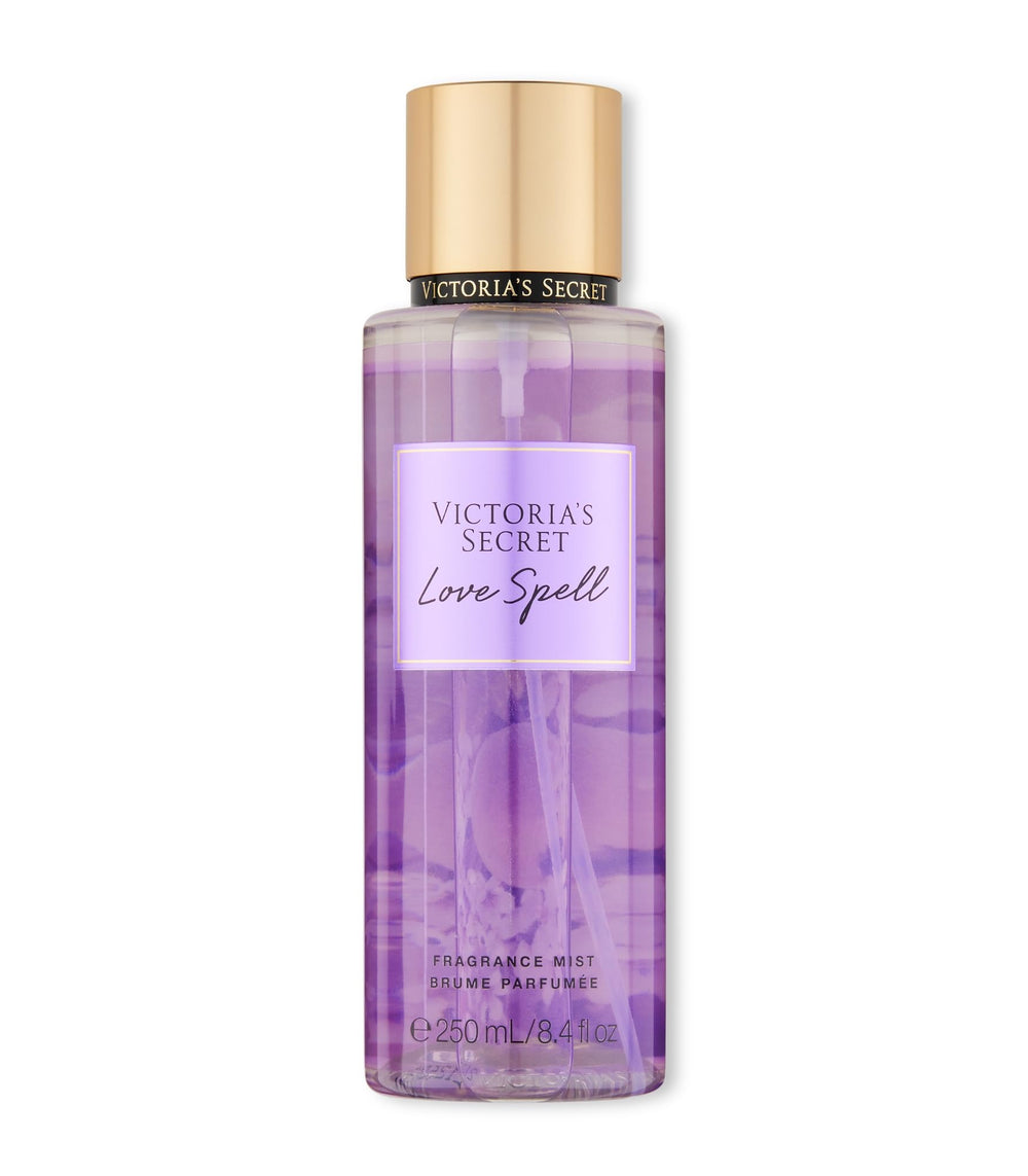 Victoria's Secret Love Spell mist bottle close-up highlighting peach and cherry blossom notes for a delicate scent.