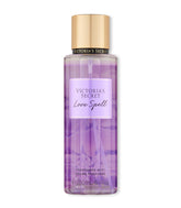 Victoria's Secret Love Spell mist bottle close-up highlighting peach and cherry blossom notes for a delicate scent.