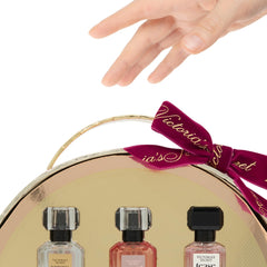 Victoria's Secret Tease mini bottle close-up reveals white gardenia and pear for flirtatious glow.