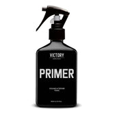 Victory Primer sea-salt-bottle demonstrates textured, fuller hair for casual beach-day style.