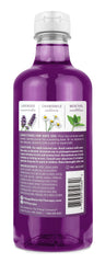 Village Naturals Therapy Nighttime Relief bath oil pour shot showing soothing bath ritual.