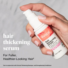 Viviscal Hair Thickening Serum dispensing drop demonstrates precise application.