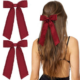 VOBOBE red tassel bow long-tail clip adds charm to party-ready hairstyles.