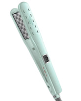 VOLOOM Rootie plate closeup demonstrates the ceramic surface for precise volumizing at the roots.