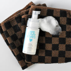 We Love Eyes tea tree eyelid cleanser close-up highlights natural ingredients and gentle lather