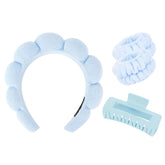 Wecoe spa headband in blue keeps hair away from the face for easy skincare.